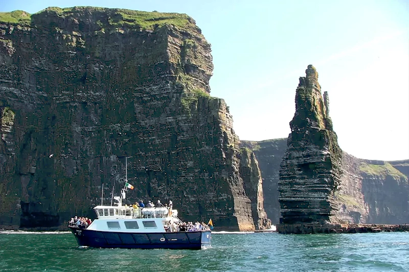 Sea ferry at the sea stack Cliffs Moher with Wild Atlantic Way Day Tours